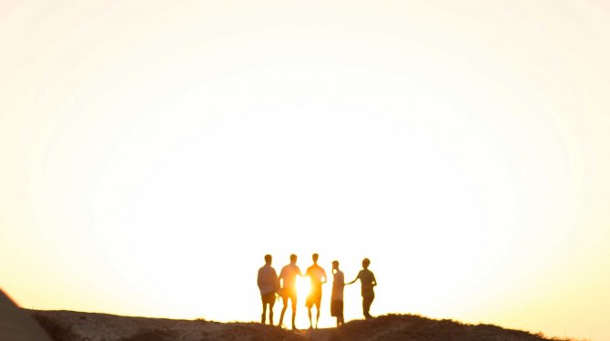 Team standing in the sun Team standing in the sun