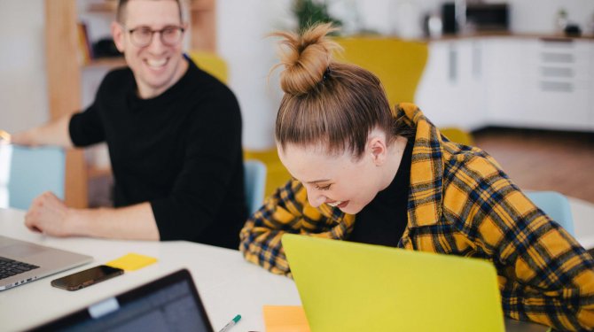 Two smiling people in a meeting Two smiling people in a meeting